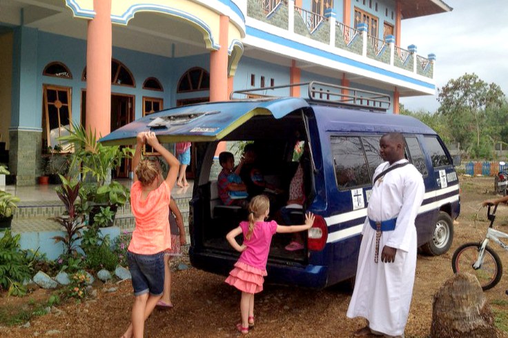 Taking local children back home after Peter and the girls took the catechism class