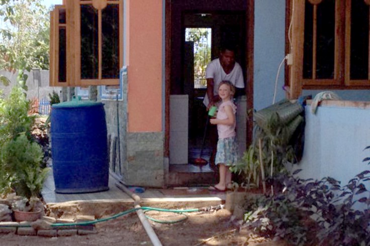 Claire helping brother outside the back kitchen door