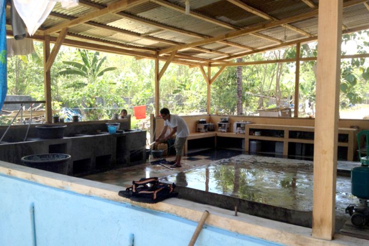 Brothers washing down outside wet area
