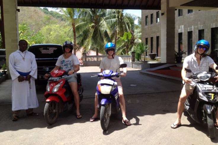 The boys, Matt, Rob and Luke hire motor bikes to follow the Missionaries of the Poor van; Brother Emmanuel likes the idea