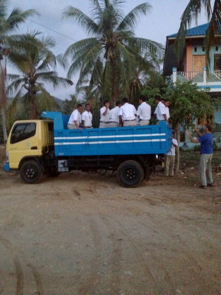 Brothers finishing their rosary in the truck