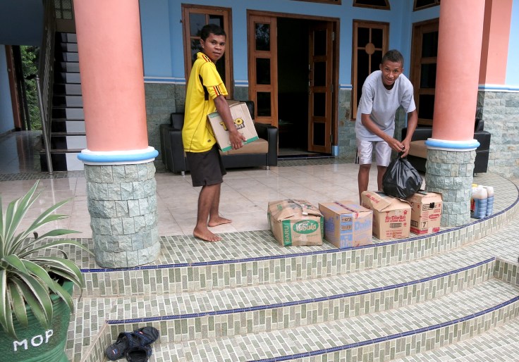 RoxyMart delivers the groceries and the brothers carry them to the store room
