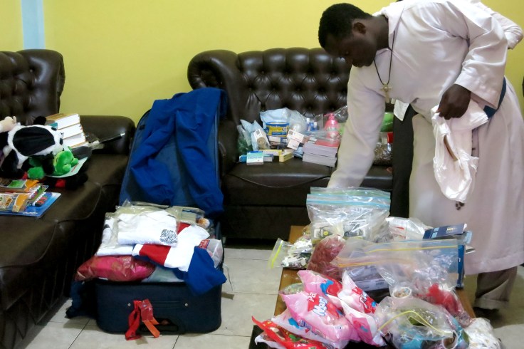 24. Unpacking supplies brought up from Australia