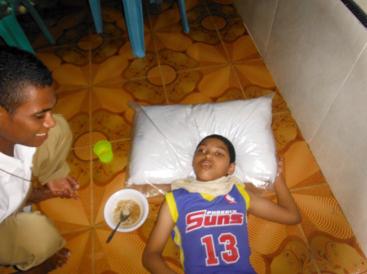 John cannot walk or sit up straight (March 2015)