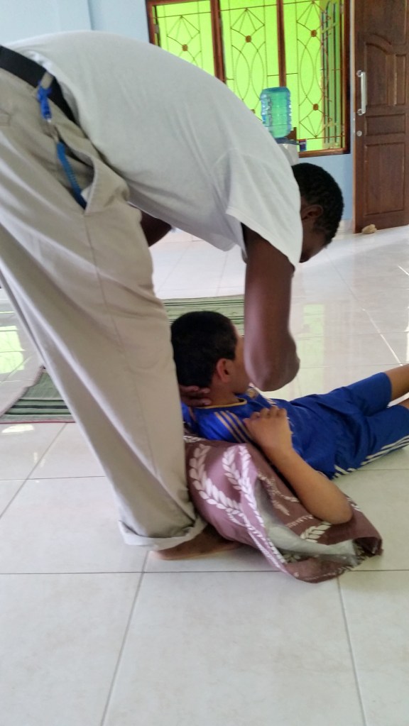 Br Geoffrey feeding John in the apostolate