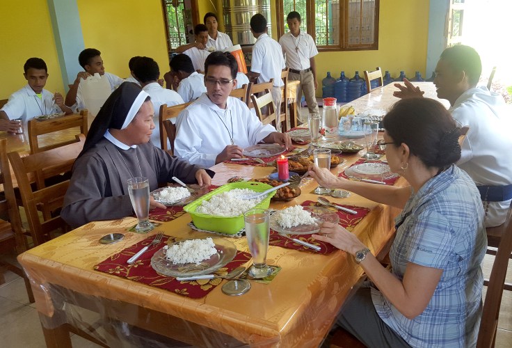 19. Greeting visitors in the dining hall
