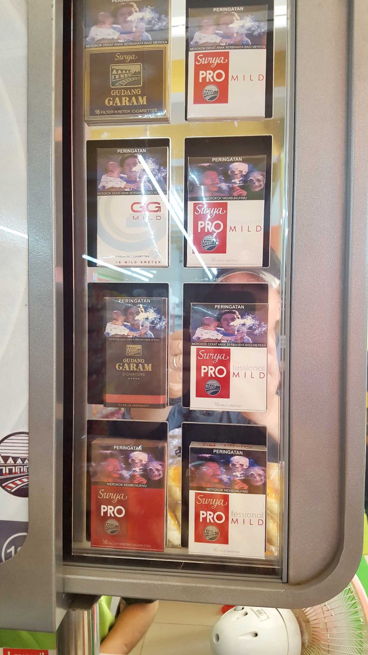 20. Cigarettes are also packaged grimly in Indonesia, notice the skulls hovering around the smoker's head