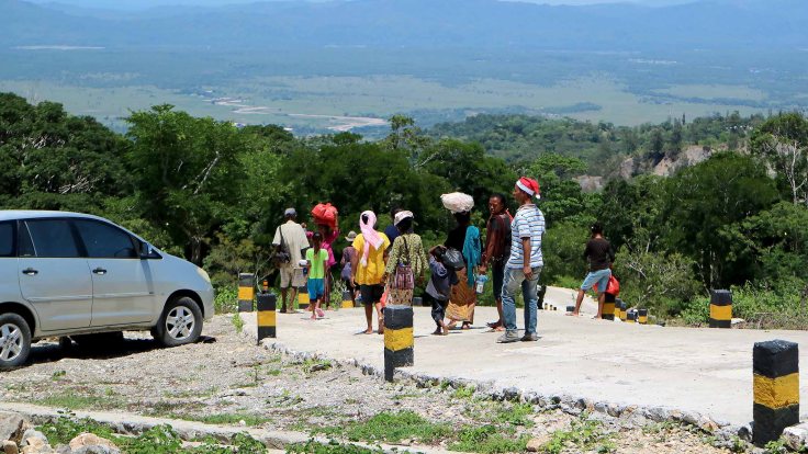 46-christmas-party-is-over-and-the-community-returns-home-carrying-food-parcels