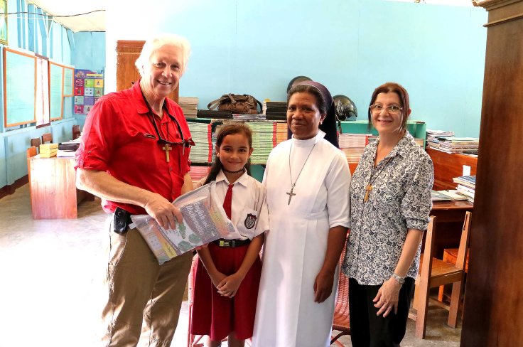 18. Small gift for the principal together with sponsor child Melania